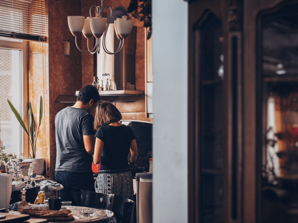 young couple cooking in kitchen
