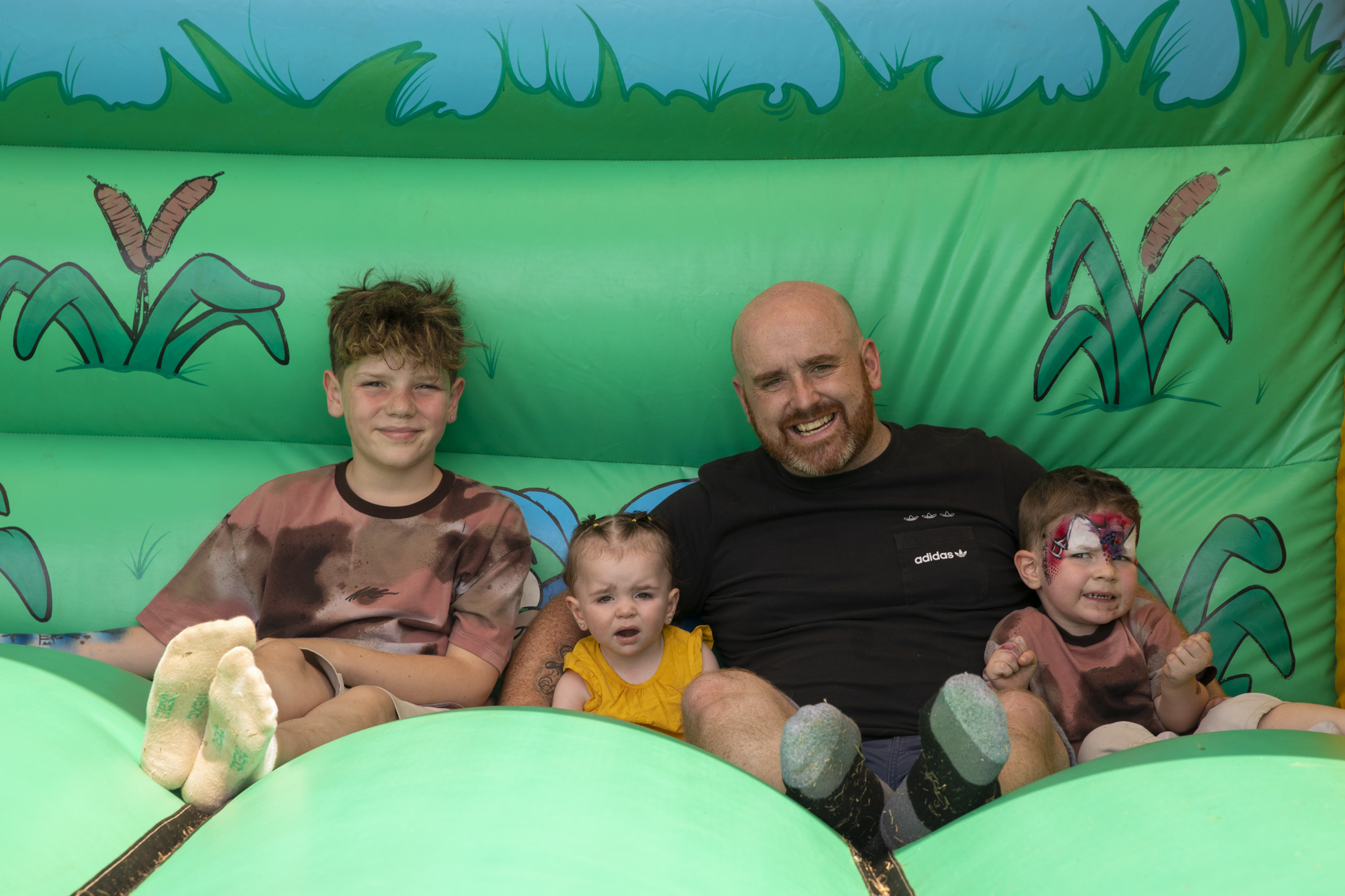 family of four in a bouncy castle