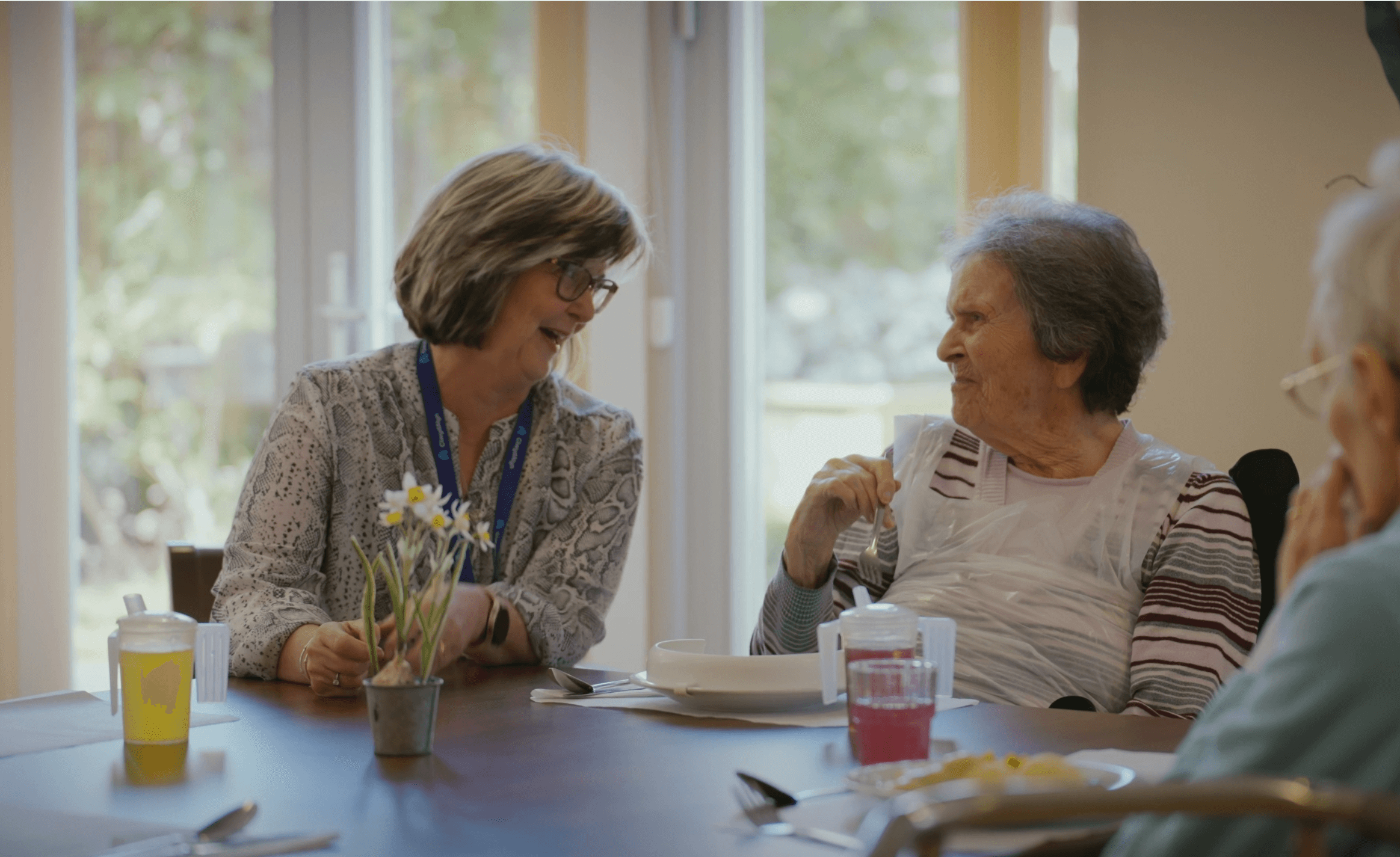 staff and residents chatting at Merton Place Nursing Home