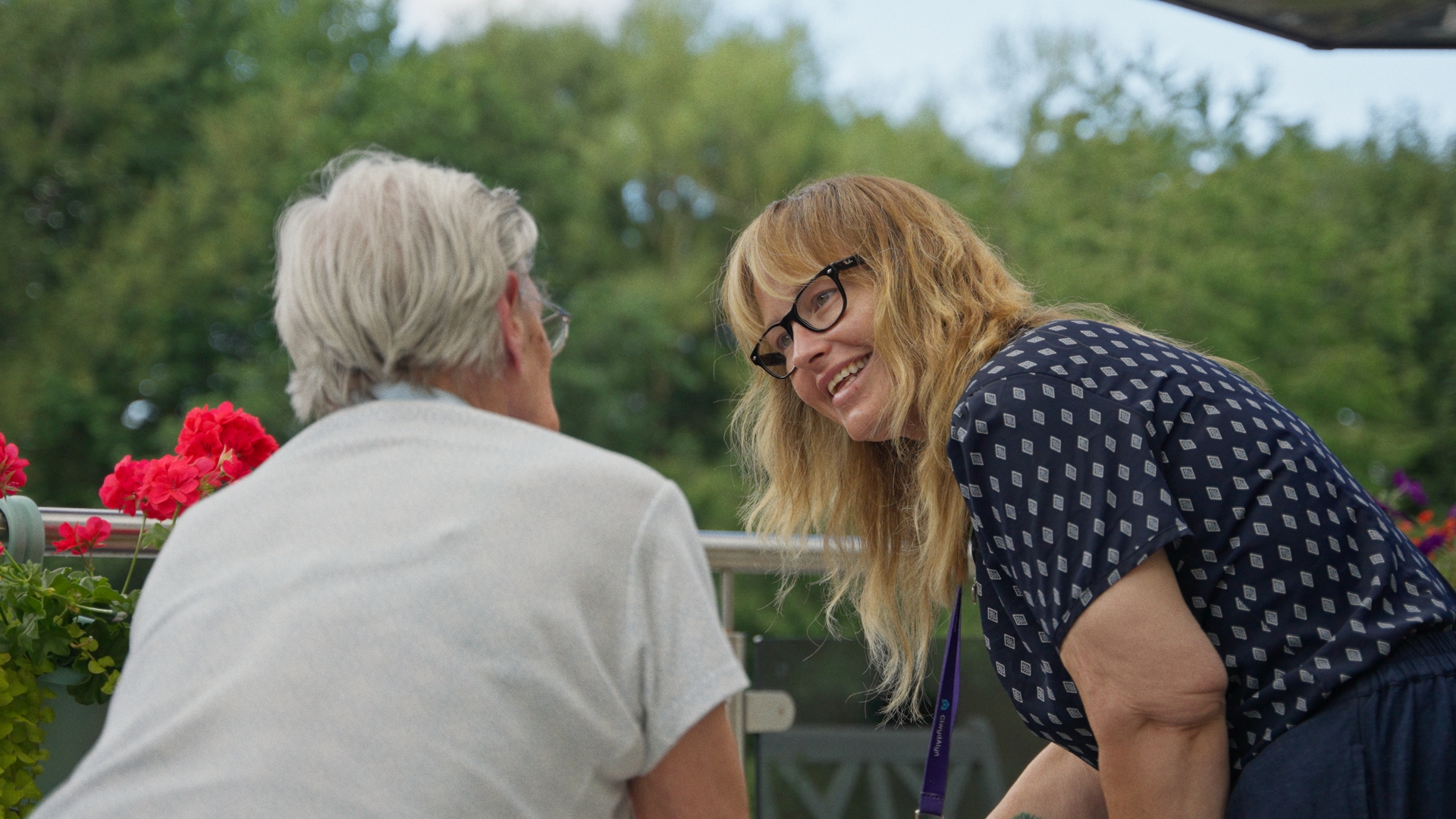 Resident and staff member talking