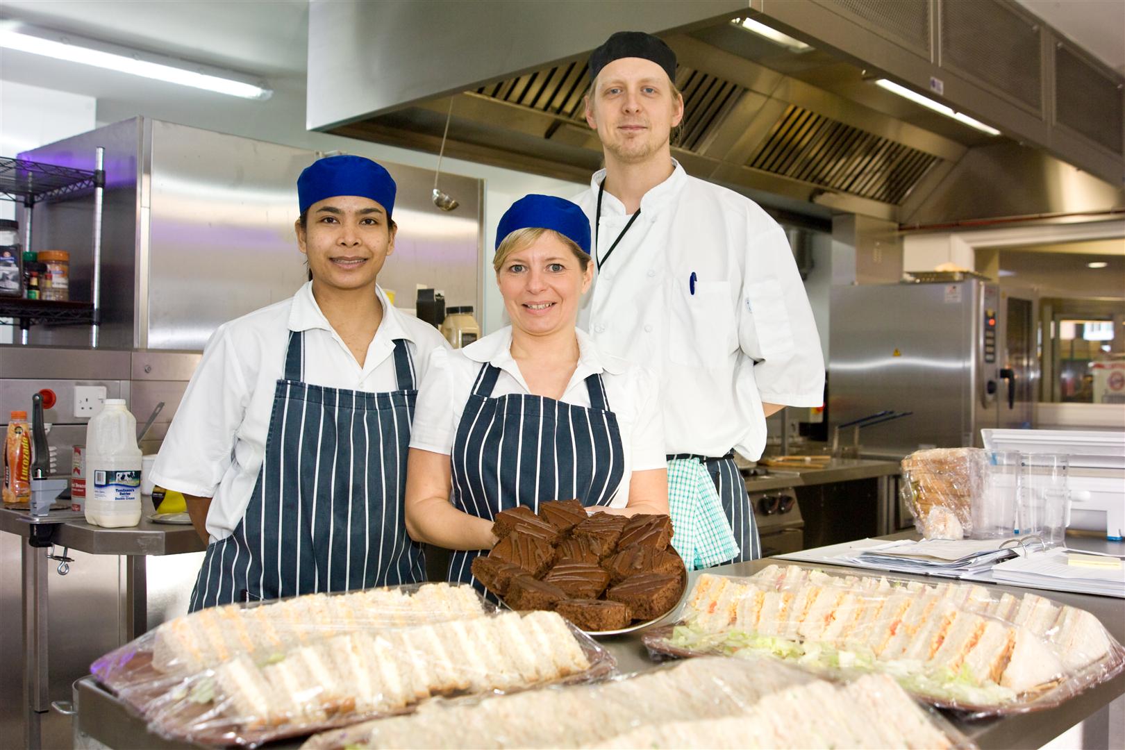 Image of catering staff with a selection of food at Plas Telford, Wrexham