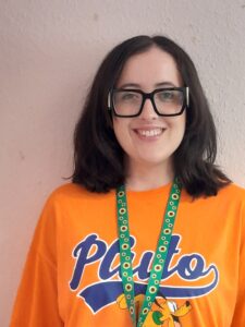 A person smiles at the camera