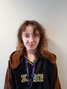 A person smiles at the camera