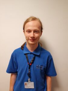 A person smiles at the camera