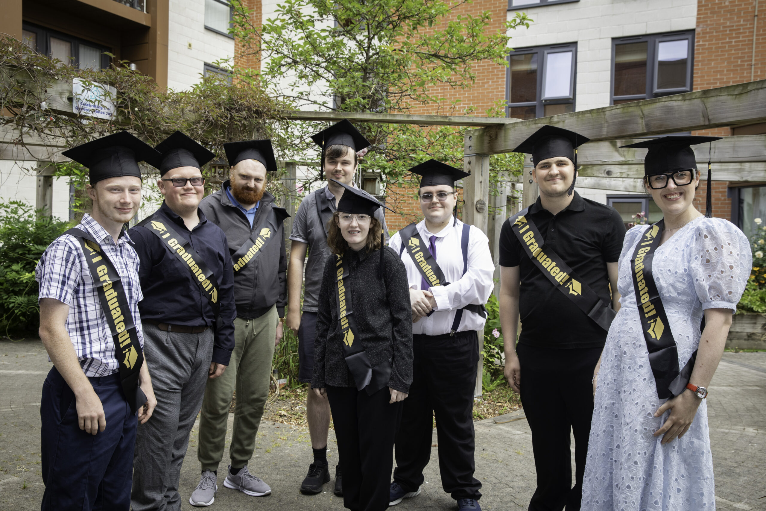 Pictures of interns who graduated from the CFN Project Search programme in 2026. Young people smile at the camera wearing graduation caps and sashes.